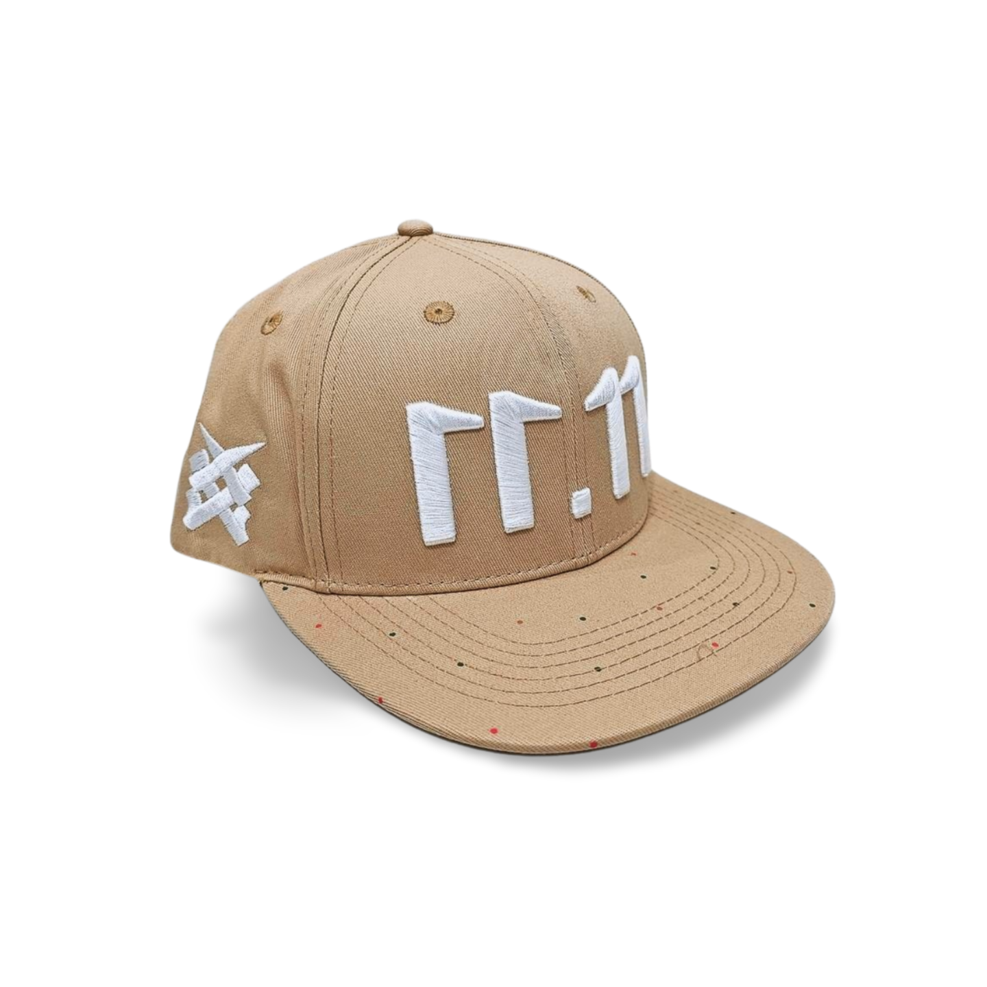 A left angled view of a beige snapback baseball cap with an embroidered white 11.11 number logo, as well as a embroidered white 11ELEVEN symbol logo on the left side of the cap on a white backdrop.
