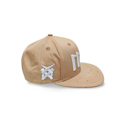 A left sided view of a beige snapback baseball cap with an embroidered white 11.11 number logo, as well as a embroidered white 11ELEVEN symbol logo on the left side of the cap on a white backdrop.