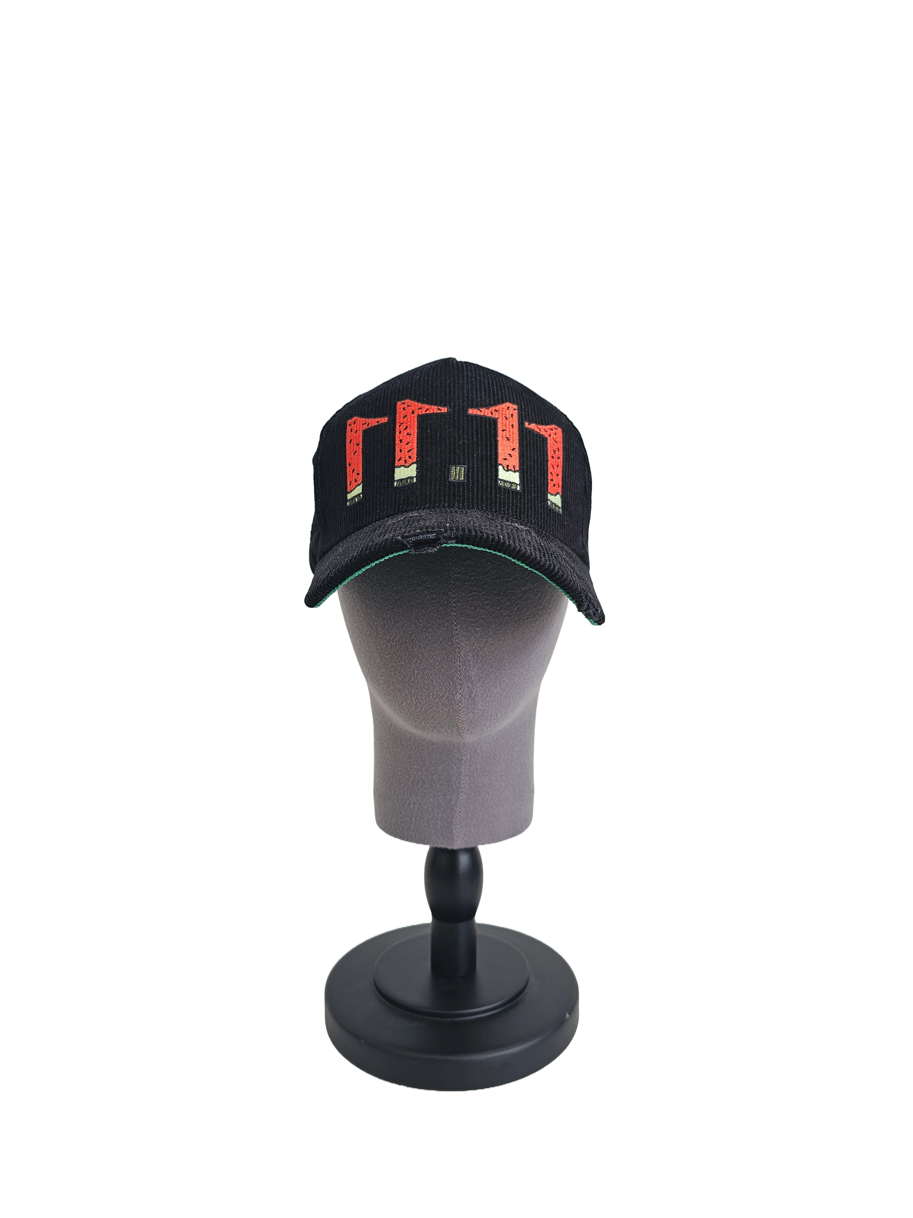 Palestine snapback cap with 11:11 logo in watermelon colors, black corduroy hat with red, green, white, and black embroidery, pro-Palestine streetwear with distressed brim