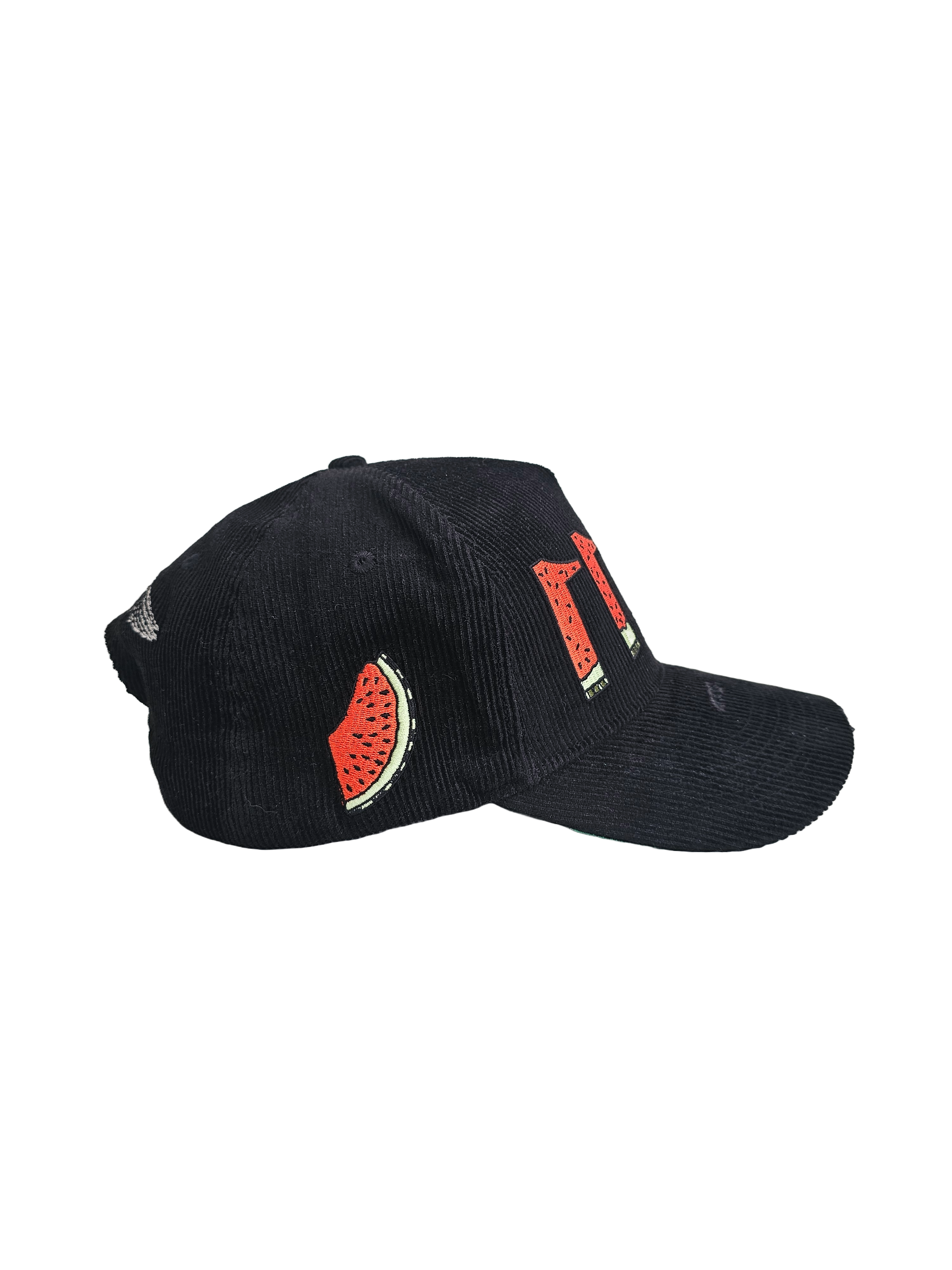 Side view of black corduroy snapback hat with embroidered 11:11 logo and watermelon slice in the shape of the Palestinian land, pro-Palestine streetwear cap symbolizing solidarity, featuring red, green, white, and black accents.