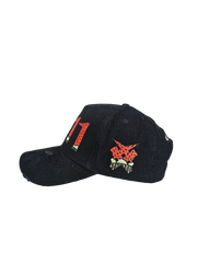 Side view of black corduroy Palestine snapback hat with 11:11 logo and embroidered watermelon slice. pro-Palestine streetwear with distressed brim and symbolic design.