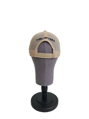 A back view of a beige snapback trucker cap on a mannequin head with an embroidered black 11.11 logo on a mesh trucker snapback cap with an adjustable cap strap